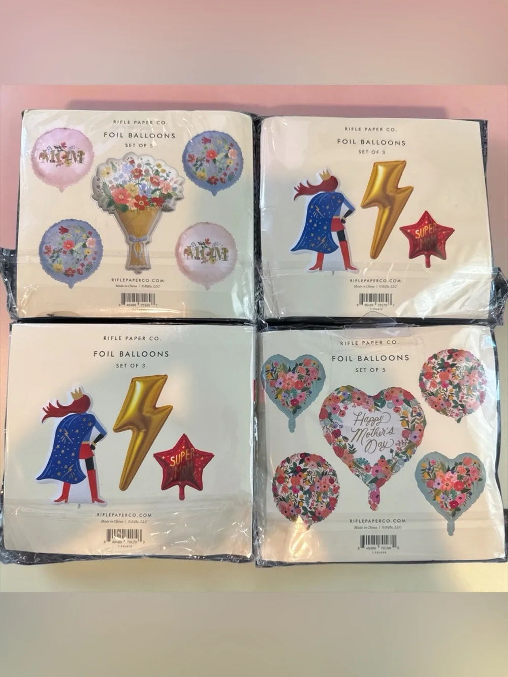 4 packages of Mothers Day Foil Balloon sets with weights